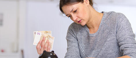 portrait of woman counting money